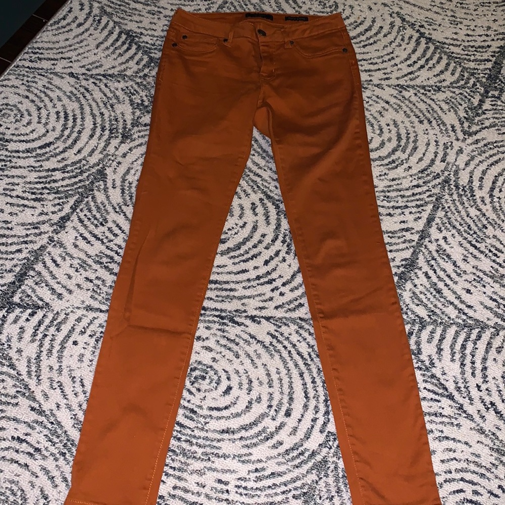 Orange mid rise skinny jeans